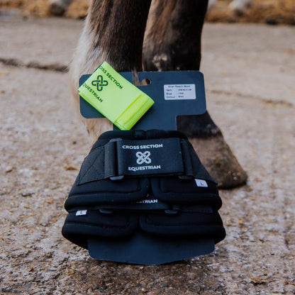 Horse hoof with protective boot and visible brand logo 